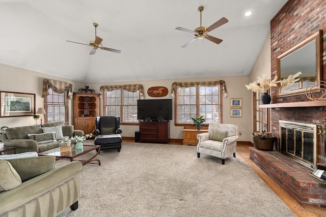 14 Frost Ln, Sudbury, MA 01776 - living room featuring ceiling fan, healthy amount of natural light, a fireplace, high vaulted ceiling, and wood finished floors