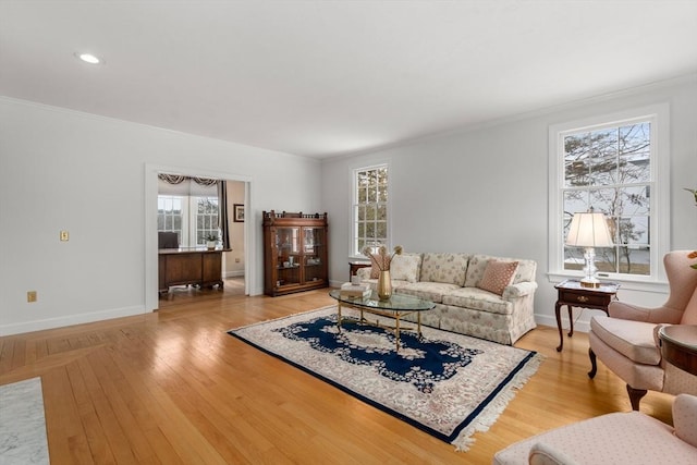 14 Frost Ln, Sudbury, MA 01776 - living room with healthy amount of natural light, light wood finished floors, and crown molding