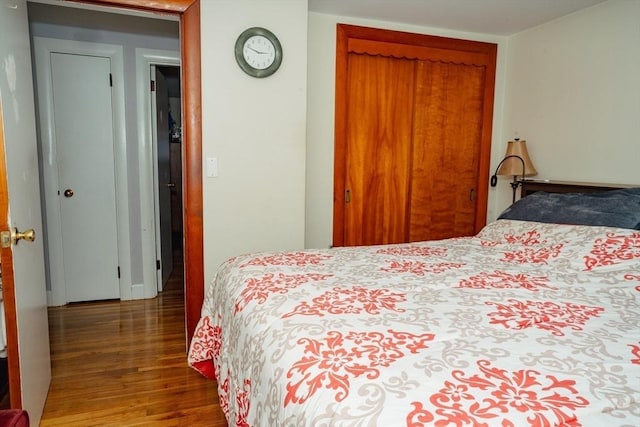 bedroom with a closet and wood finished floors