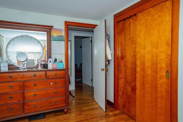 bedroom featuring a closet and wood finished floors