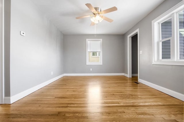 spare room with light hardwood / wood-style flooring and ceiling fan