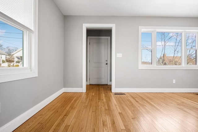 empty room with light wood-type flooring