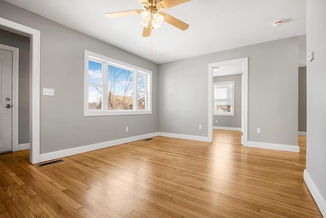 unfurnished room with light hardwood / wood-style floors and ceiling fan