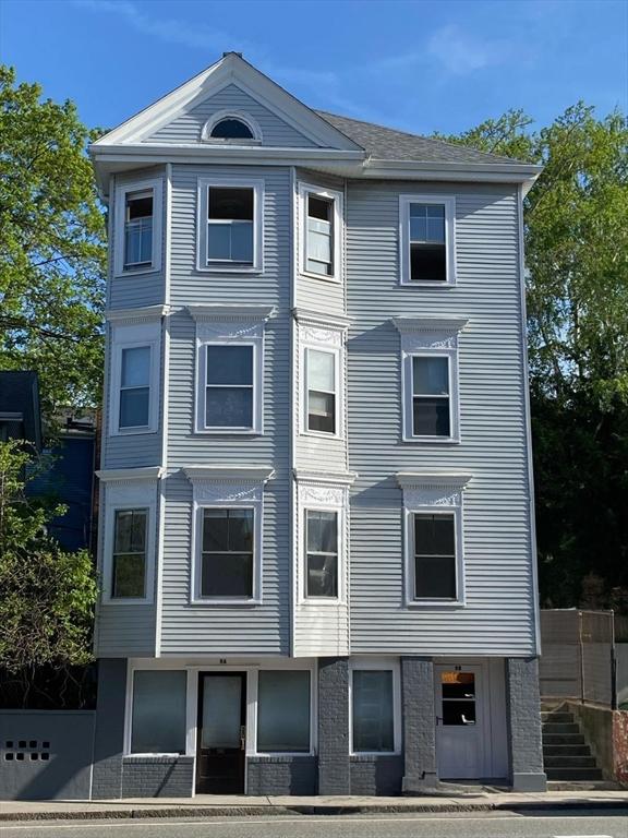 view of front of property featuring stairs