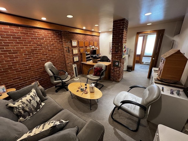 living room featuring recessed lighting, brick wall, a desk, and carpet flooring