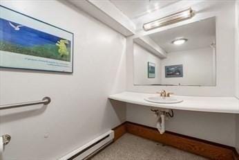 bathroom with a baseboard heating unit