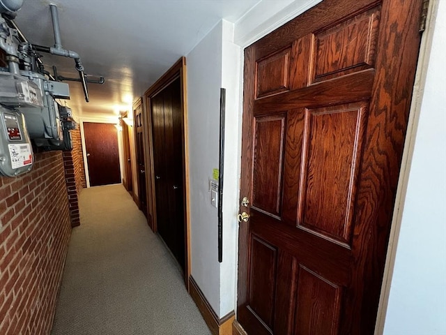 hall featuring light carpet