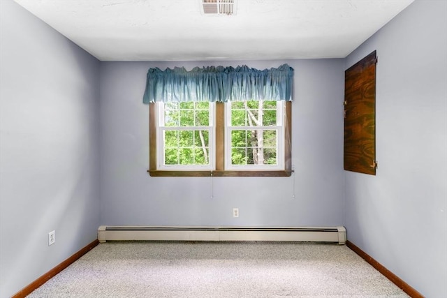 27 Woodland St, Natick, MA 01760 - carpeted empty room featuring baseboards and a baseboard radiator