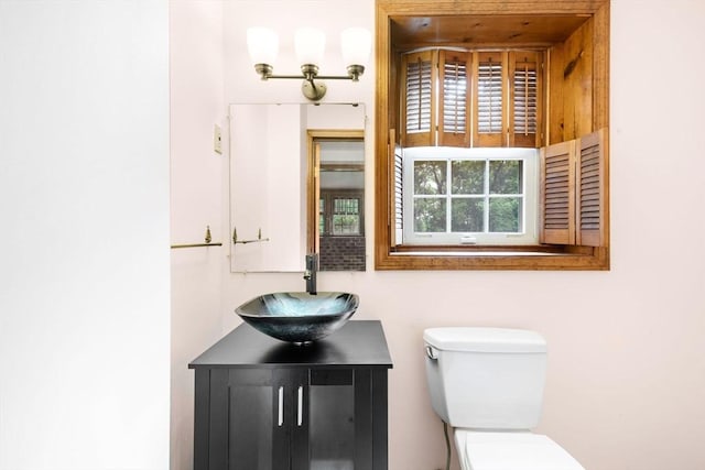 27 Woodland St, Natick, MA 01760 - half bathroom featuring toilet and vanity