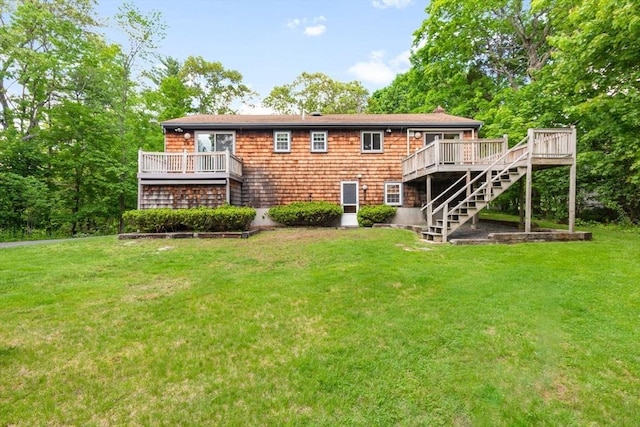 27 Woodland St, Natick, MA 01760 - rear view of property with stairway, a wooden deck, and a yard