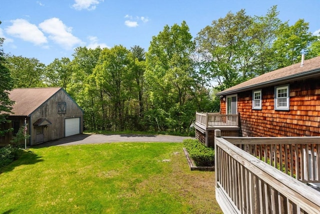 27 Woodland St, Natick, MA 01760 - view of grassy yard with a garage and an outdoor structure