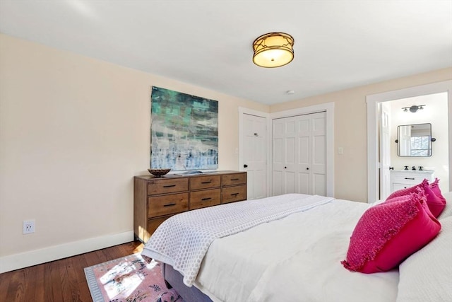 bedroom featuring a closet, baseboards, and wood finished floors