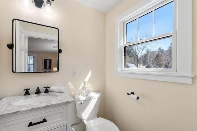 bathroom with vanity and toilet