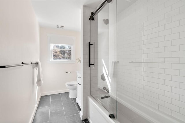 bathroom with visible vents, baseboards, toilet, tile patterned floors, and enclosed tub / shower combo