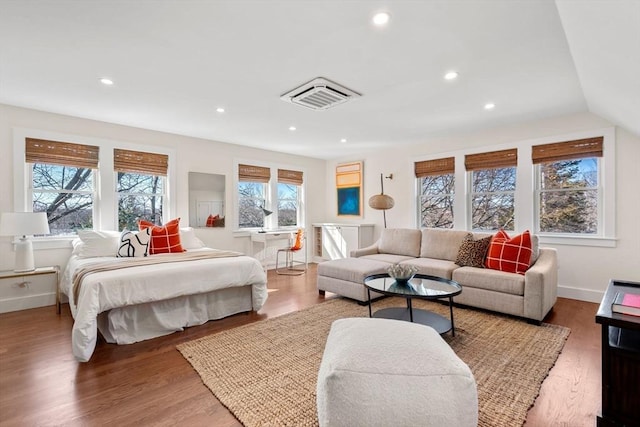 bedroom featuring recessed lighting, wood finished floors, and visible vents