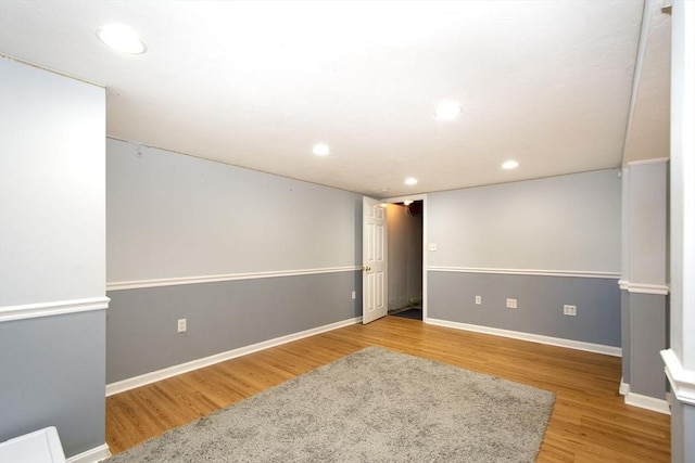 basement with recessed lighting, baseboards, and wood finished floors