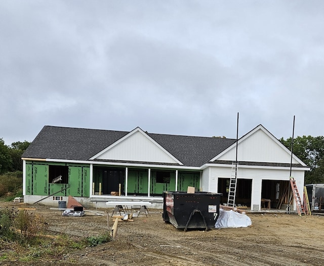 back of house with an outdoor structure