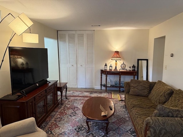 living area featuring visible vents