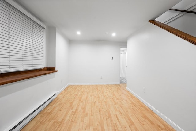 19 Dalrymple St Unit D, Boston, MA 02130 - spare room featuring a baseboard radiator, recessed lighting, and wood finished floors