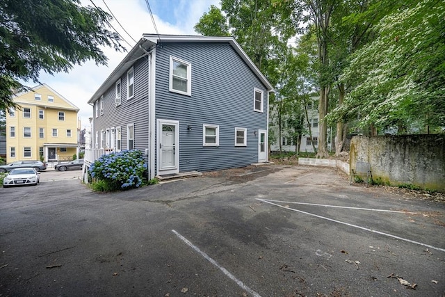 19 Dalrymple St Unit D, Boston, MA 02130 - rear view of house featuring uncovered parking