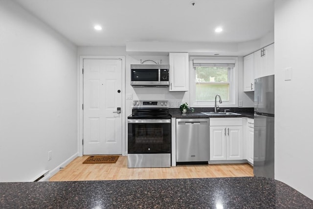 19 Dalrymple St Unit D, Boston, MA 02130 - kitchen with appliances with stainless steel finishes, white cabinetry, recessed lighting, and light wood finished floors