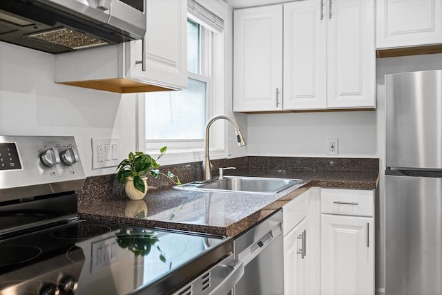 19 Dalrymple St Unit D, Boston, MA 02130 - kitchen featuring stainless steel appliances, white cabinetry, and dark countertops