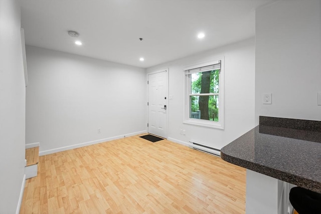 19 Dalrymple St Unit D, Boston, MA 02130 - foyer featuring baseboard heating, wood finished floors, and recessed lighting