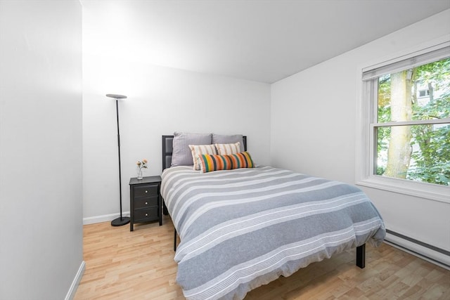 19 Dalrymple St Unit D, Boston, MA 02130 - bedroom featuring light wood-style flooring and a baseboard radiator