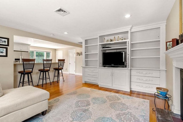 12 Shore Ave, Salem, MA 01970 - living area featuring light wood-type flooring, recessed lighting, and a fireplace with flush hearth