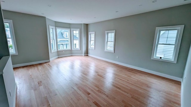 unfurnished room with light hardwood / wood-style flooring