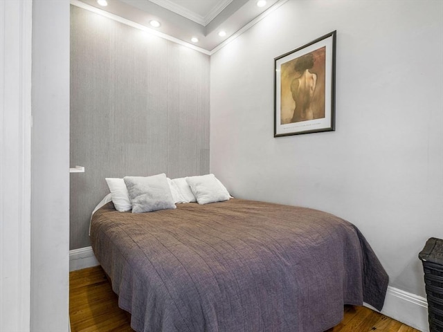 bedroom featuring dark wood-type flooring and ornamental molding