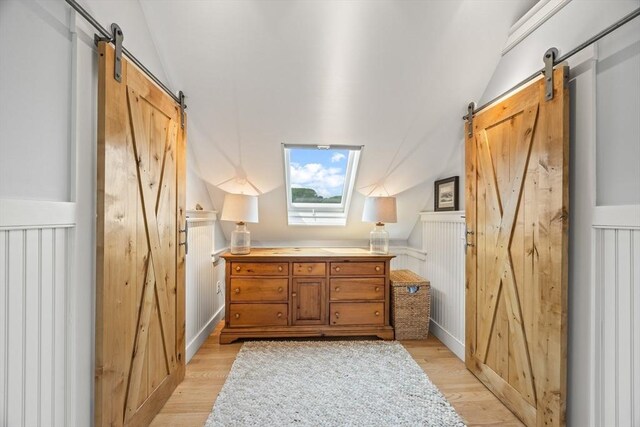 10 Seashore Park Dr Unit Gg, Provincetown, MA 02657 - bathroom with vaulted ceiling and wood finished floors