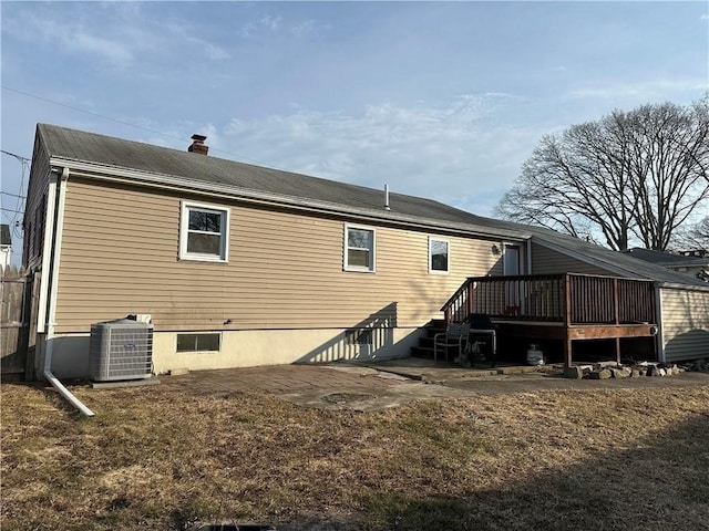 55 Swan St, East Providence, RI 02914 - back of property featuring cooling unit, a chimney, and a wooden deck