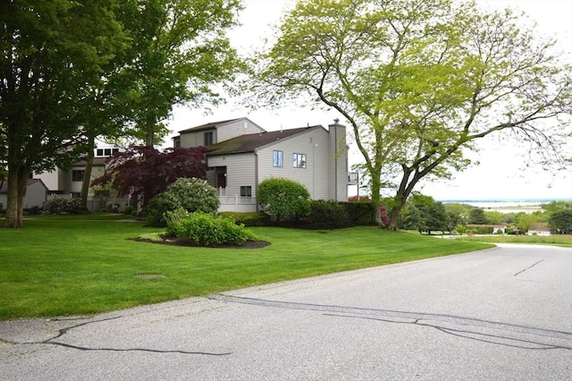 272 N Farm Dr Unit 272, Bristol, RI 02809 - view of front facade with a front lawn and a chimney
