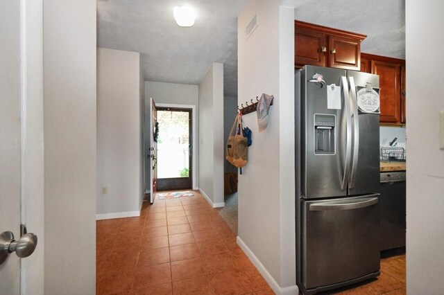 272 N Farm Dr Unit 272, Bristol, RI 02809 - kitchen with stainless steel fridge, baseboards, and light tile patterned flooring