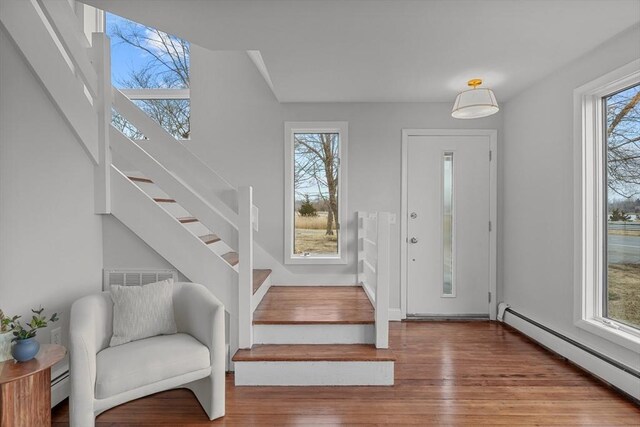 1705 Wampanoag Trl, Barrington, RI 02806 - foyer featuring a baseboard radiator, stairway, and wood finished floors