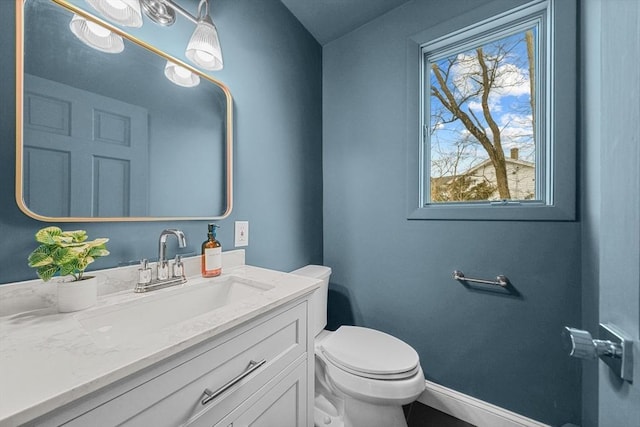 1705 Wampanoag Trl, Barrington, RI 02806 - bathroom featuring toilet, baseboards, and vanity