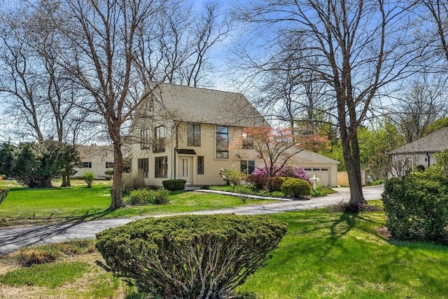 1705 Wampanoag Trl, Barrington, RI 02806 - view of front facade with a front lawn and a garage