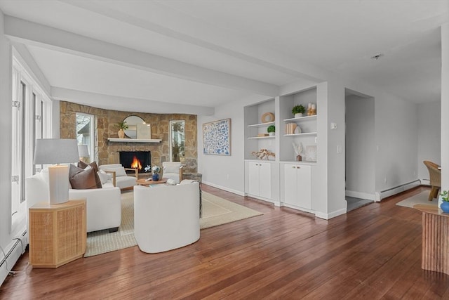 1705 Wampanoag Trl, Barrington, RI 02806 - living area with a baseboard heating unit, hardwood / wood-style floors, a stone fireplace, and baseboards