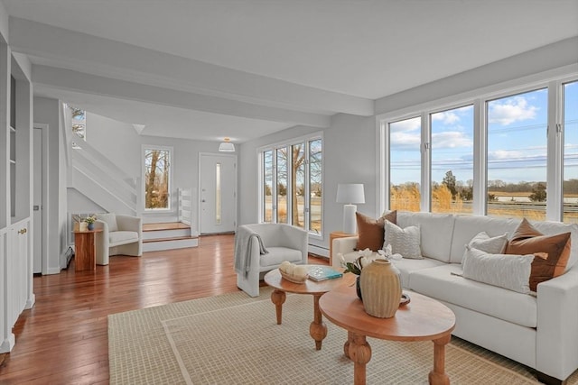 1705 Wampanoag Trl, Barrington, RI 02806 - living room with wood finished floors, healthy amount of natural light, and baseboard heating