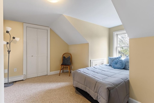 carpeted bedroom with vaulted ceiling, baseboards, and baseboard heating