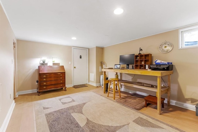 office featuring light wood finished floors, recessed lighting, and baseboards