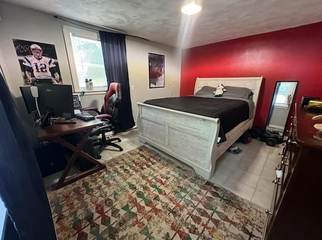 728 Stony Hill Rd, Wilbraham, MA 01095 - tiled bedroom with a desk and a textured ceiling