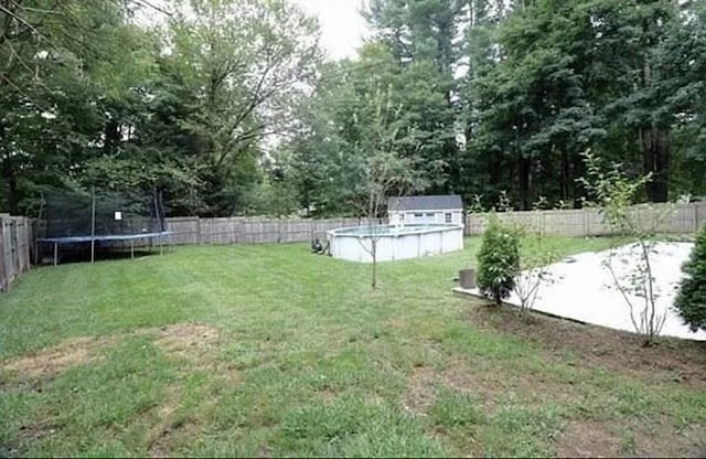 728 Stony Hill Rd, Wilbraham, MA 01095 - fenced backyard with a trampoline and a storage shed