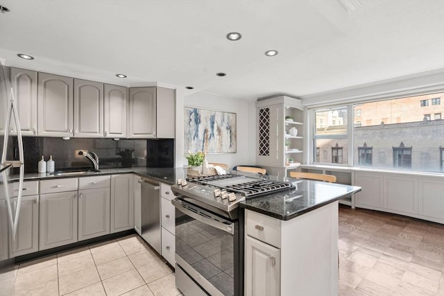 151 Tremont St Unit 8S, Boston, MA 02111 - kitchen featuring a peninsula, recessed lighting, tasteful backsplash, a sink, and stainless steel appliances