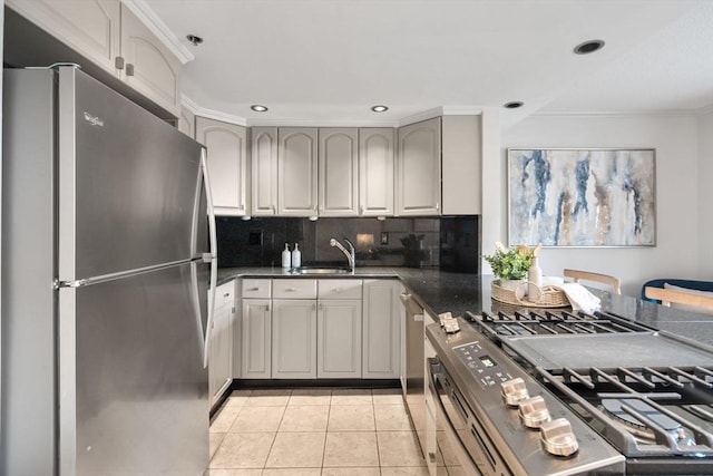 151 Tremont St Unit 8S, Boston, MA 02111 - kitchen with appliances with stainless steel finishes, tasteful backsplash, a sink, light tile patterned floors, and recessed lighting