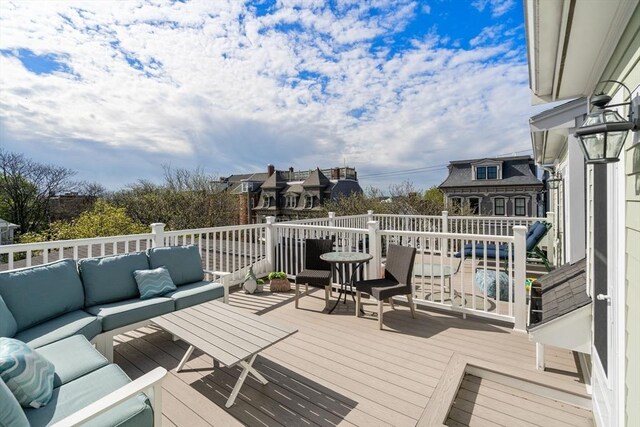 wooden terrace featuring outdoor lounge area