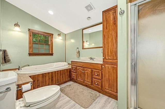 full bathroom featuring lofted ceiling, toilet, shower with separate bathtub, vanity, and hardwood / wood-style floors