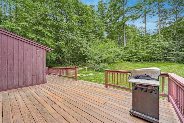 wooden terrace with a yard