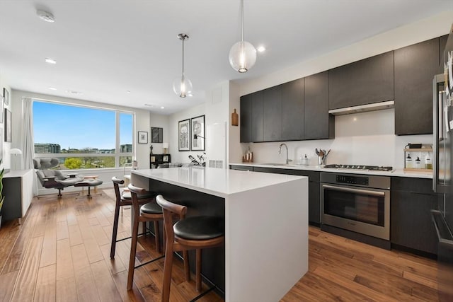 99 Sumner St Unit 315, Boston, MA 02128 - kitchen with a sink, open floor plan, light countertops, and appliances with stainless steel finishes